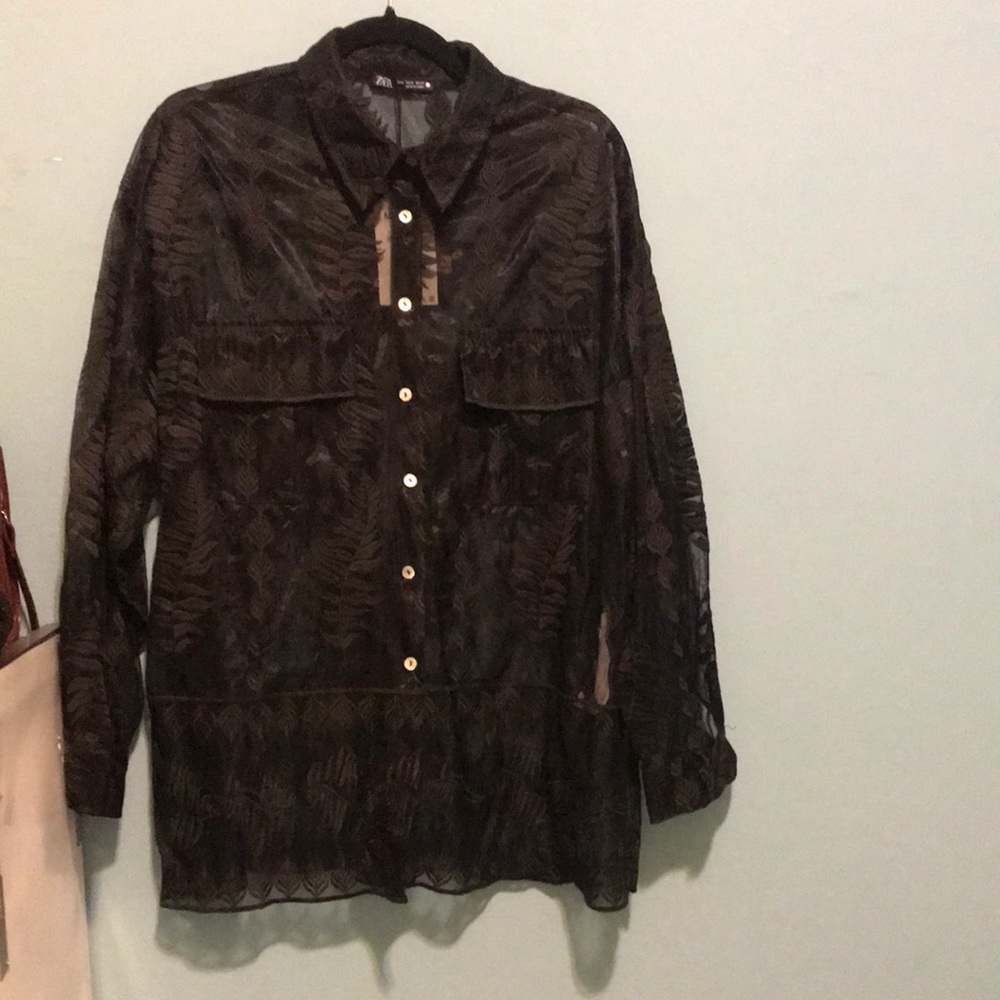 Embroidered sheer shirt.